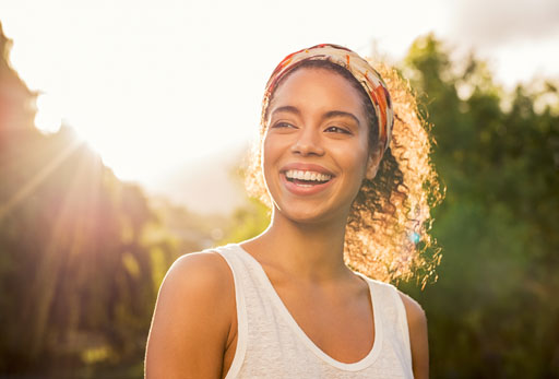 Woman smiling at sunset